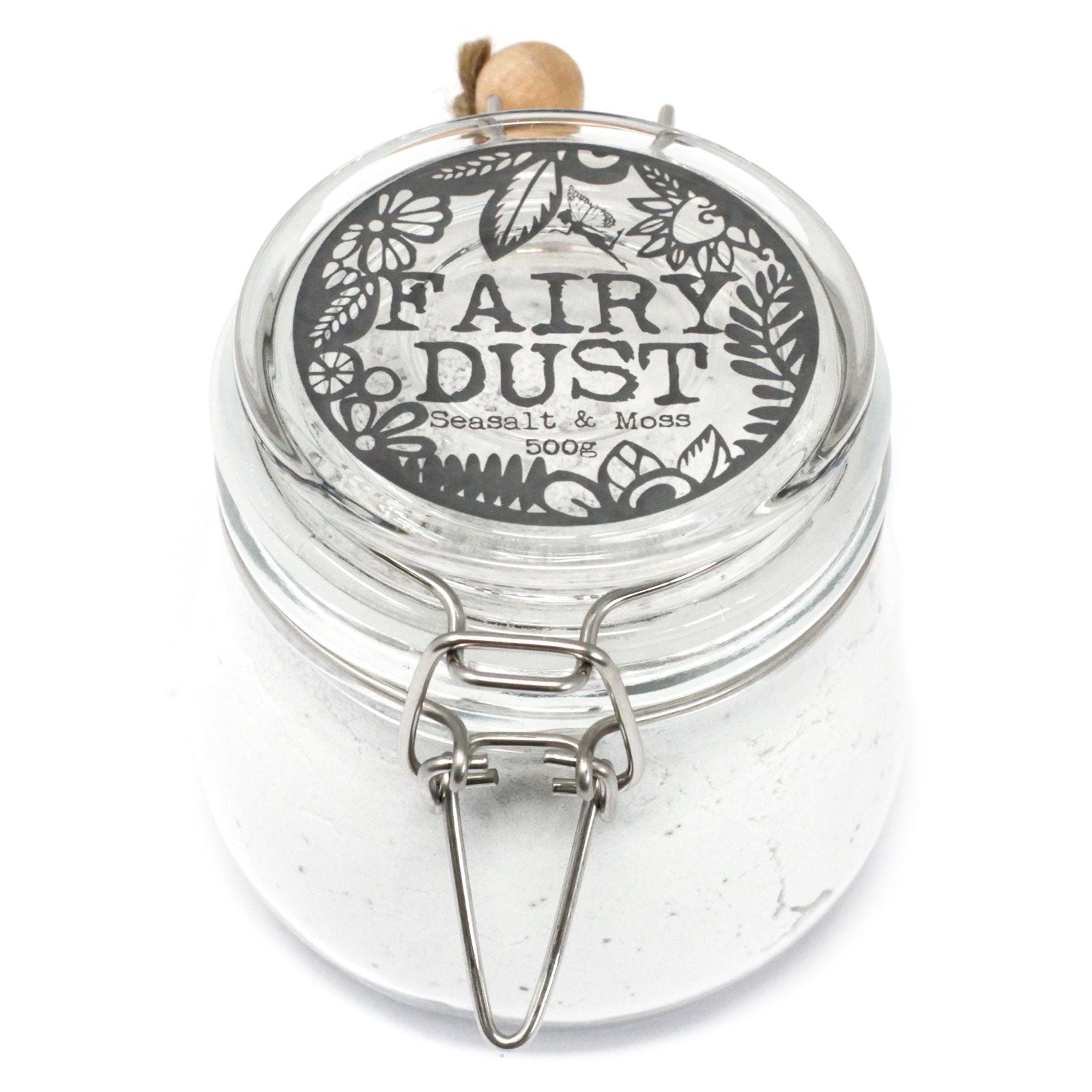 A large apothecary-style glass jar with a wooden spoon, filled with 500g of white Seasalt and Moss bath fizzing powder.