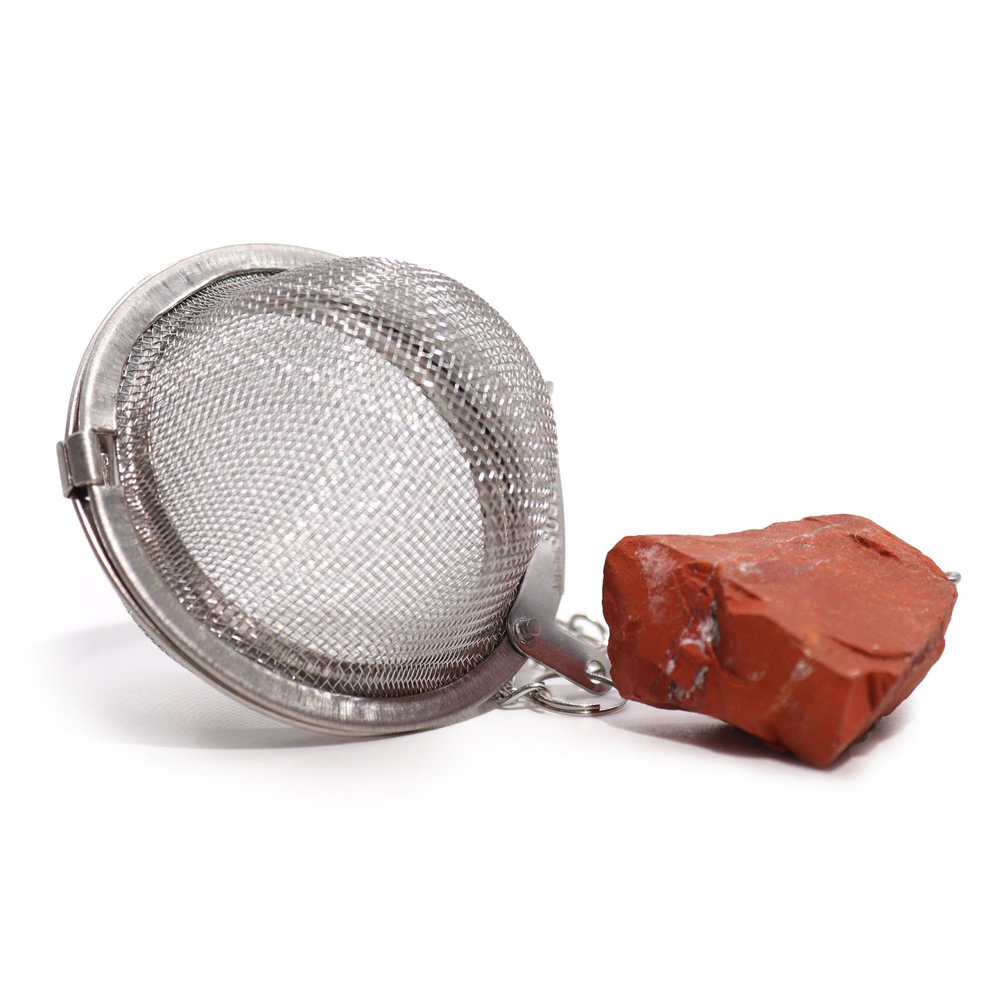 Silver stainless steel tea infuser ball on a chain with a raw red Jasper gemstone charm attached.
