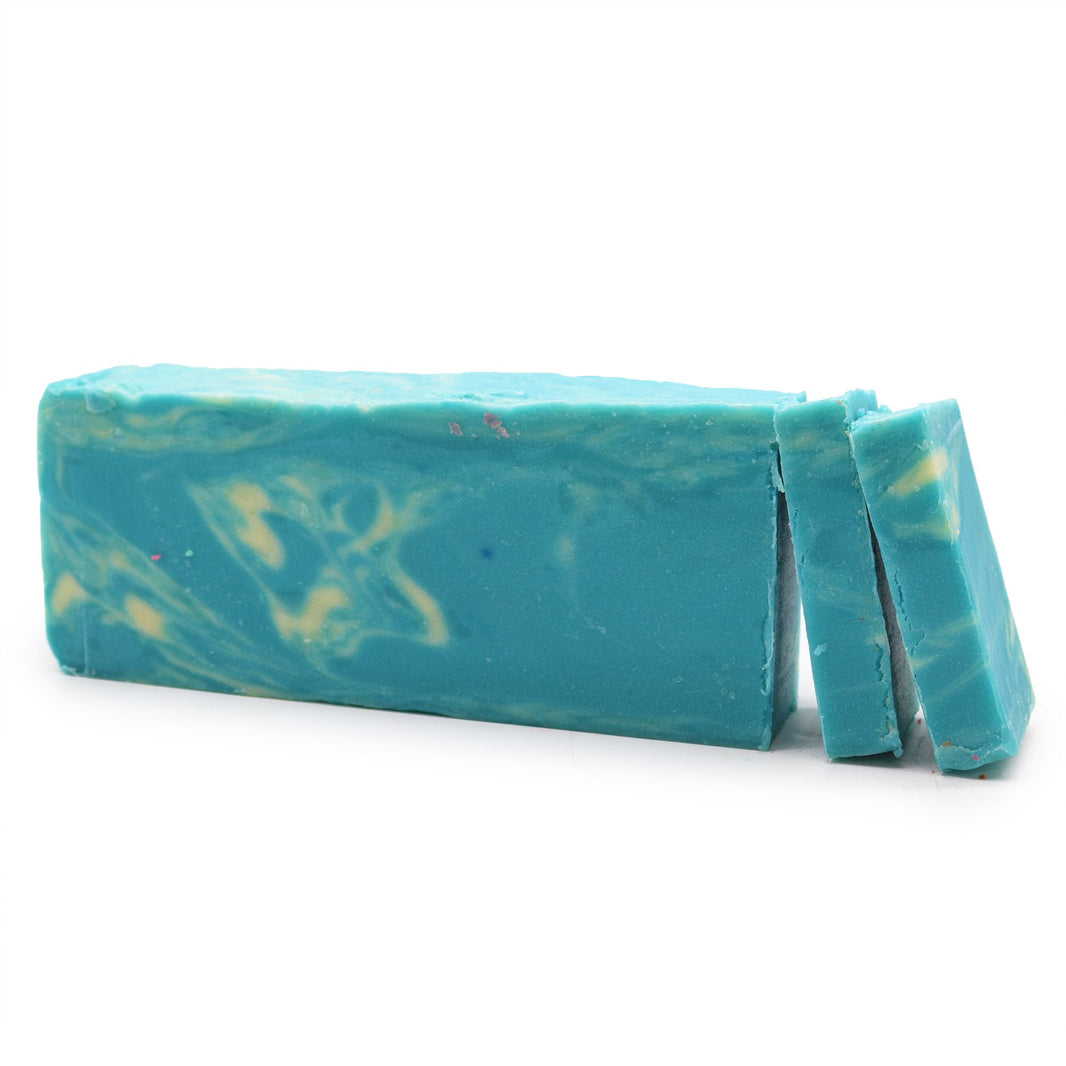 A large 1.25kg handcrafted seaweed soap loaf with deep green and blue tones, ready to be sliced into bars.