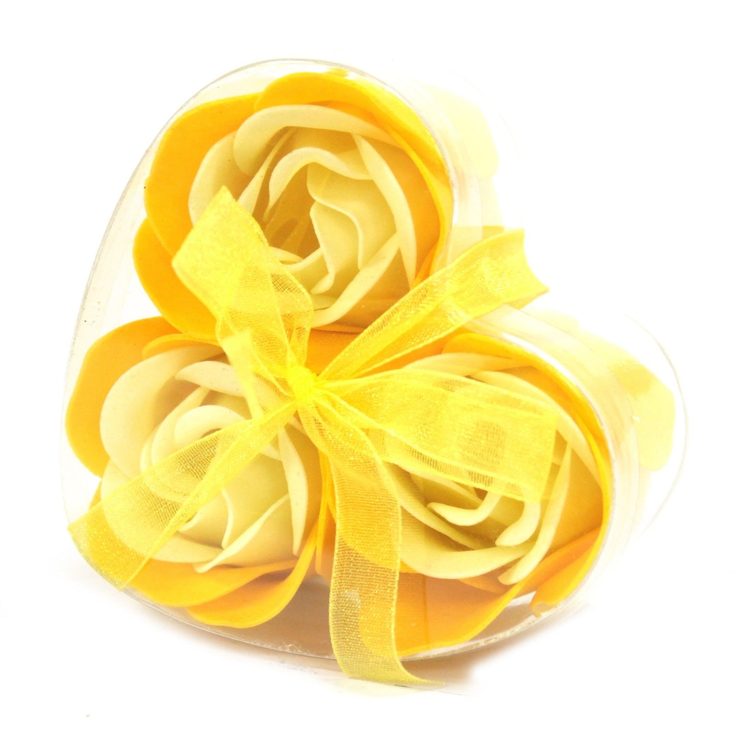A small heart-shaped gift box containing three realistic yellow soap rose flowers in a bright spring-inspired shade.