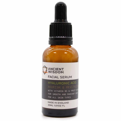 An amber glass dropper bottle of hyaluronic acid facial serum displayed with a modern, minimalist label.