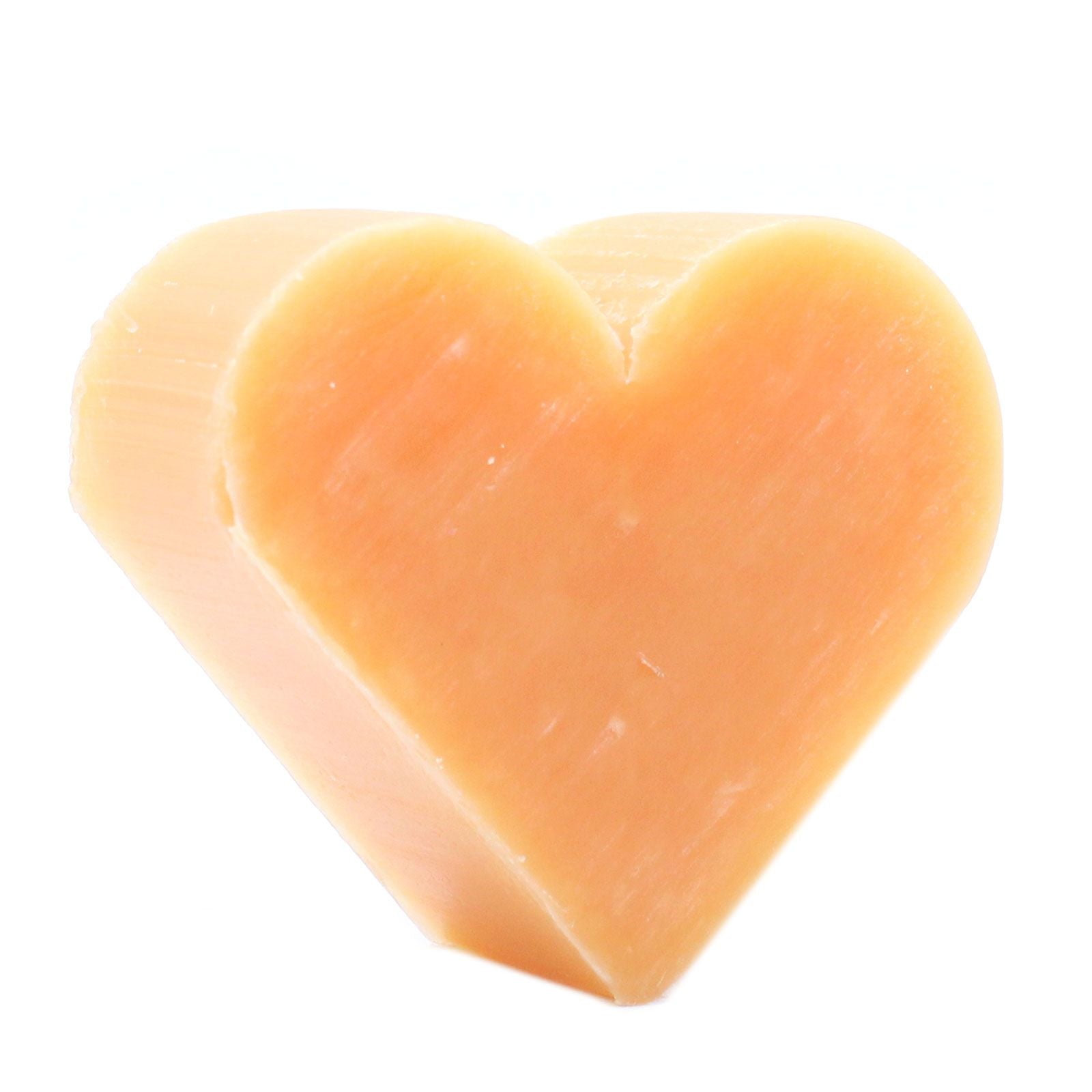 Ten orange heart-shaped mini guest soaps featuring a zesty citrus and warm ginger fragrance.