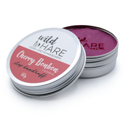 A red-themed 60g solid shampoo bar in a tin, labeled Wild Hare Cherry Bonbon for sustainable hair care.