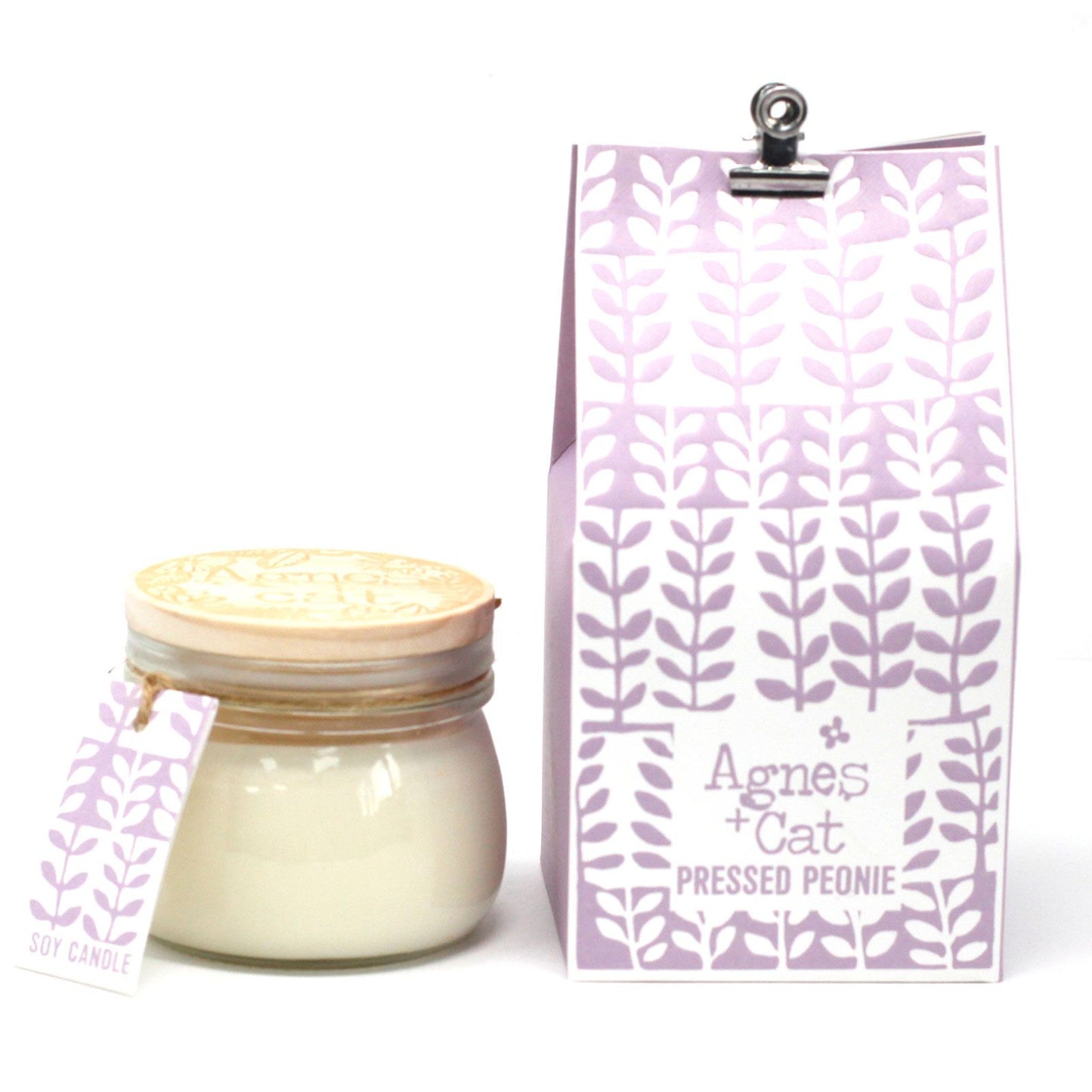 A rustic glass Kilner jar candle with a purple floral label, featuring a classic airtight clip-top lid.