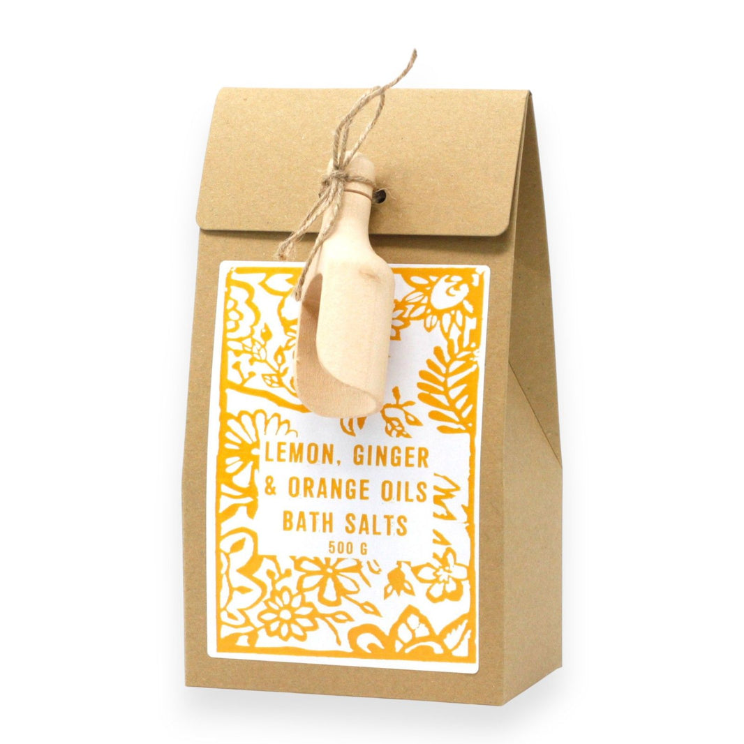 A 500g bag of aromatic bath salts featuring zesty lemon, warming ginger, and sweet orange essential oils.