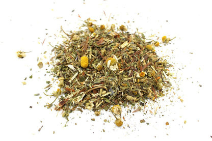 A high-volume quantity of loose herbal tea featuring dried botanicals, green leaves, and golden flower petals.