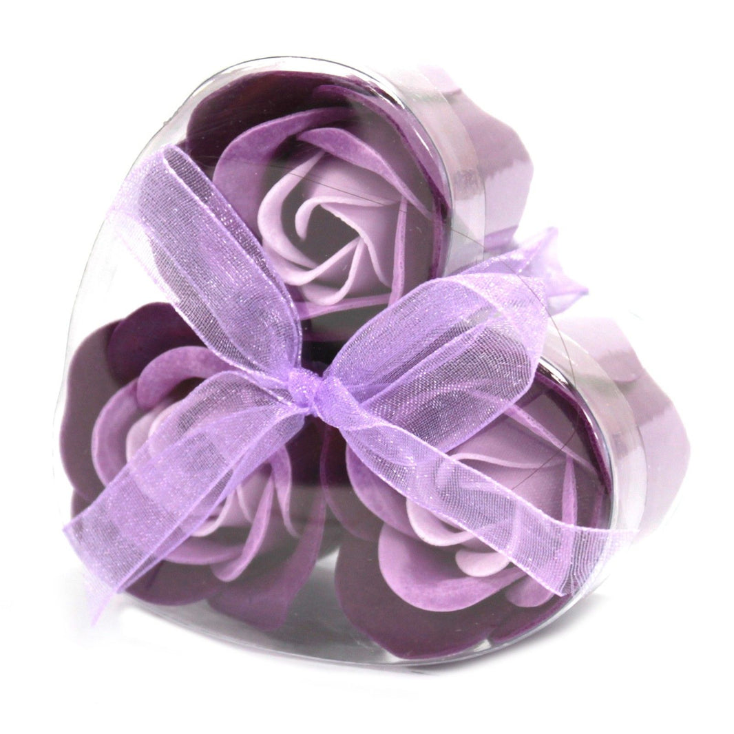 A small heart-shaped gift box featuring three realistic purple lavender soap rose flowers.