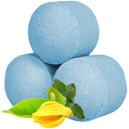A bulk collection of light blue mini bath bombs featuring a sophisticated ylang-ylang and patchouli herbal infusion.