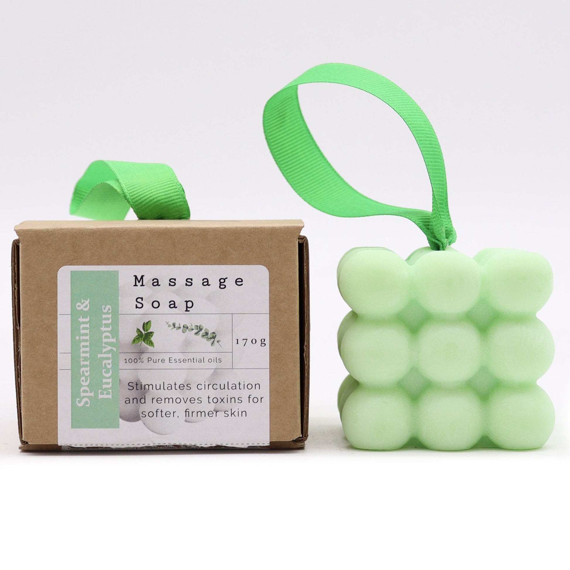 A light green textured massage soap bar with essential oils of Spearmint and Eucalyptus, packaged in a decorative gift box.