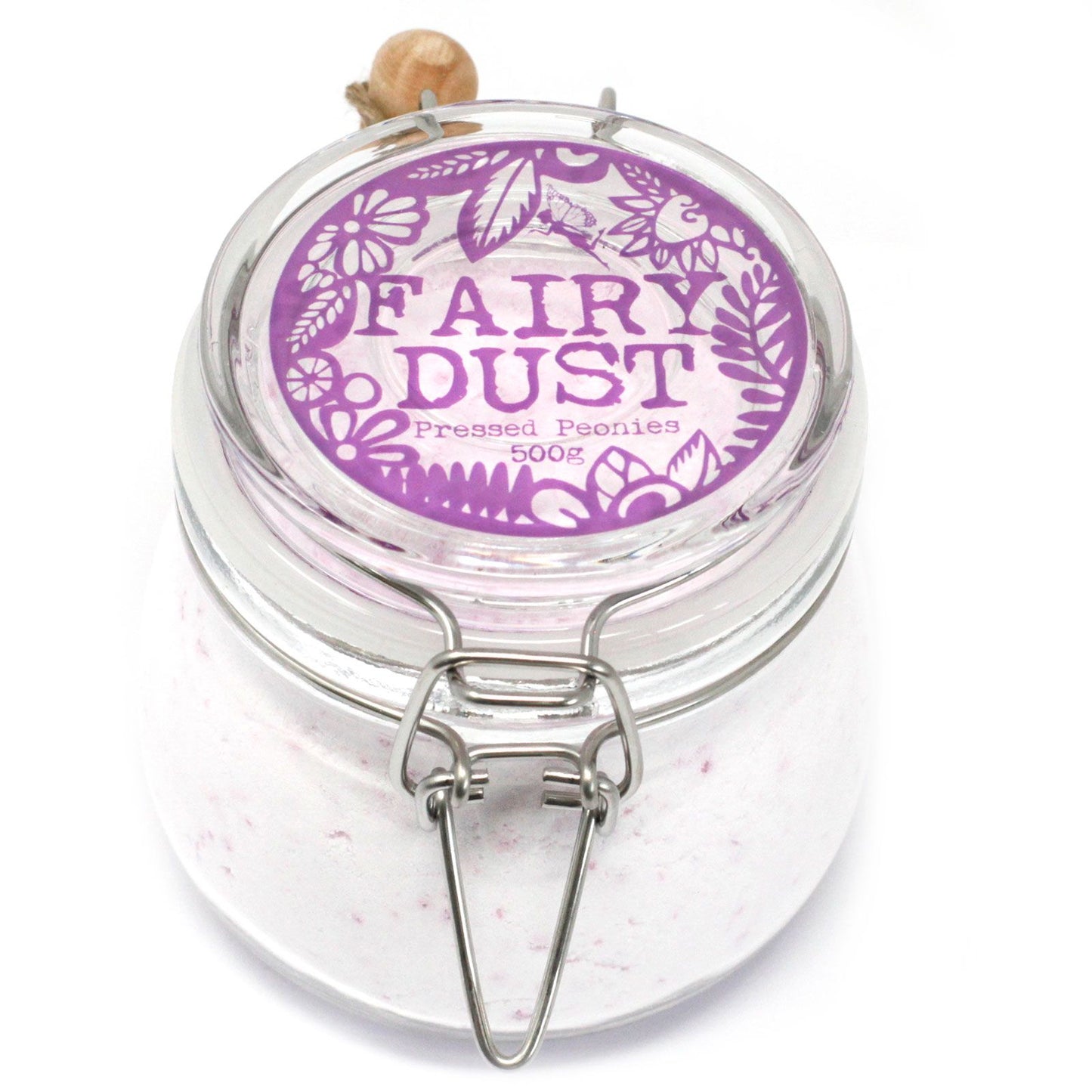A premium glass jar with a cork lid and wooden scoop containing 500g of light purple-tinted floral bath fizzing dust.
