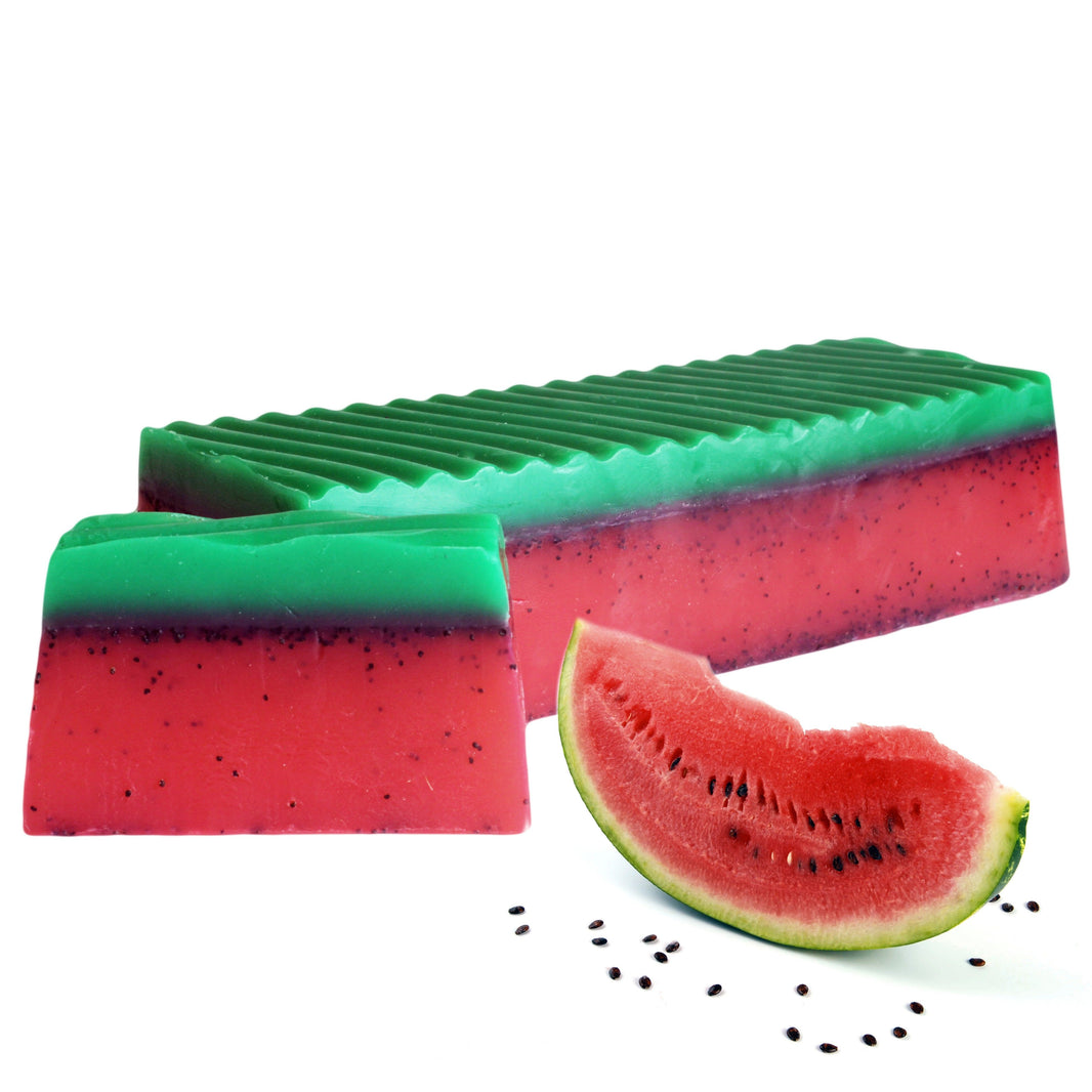 A large 1.1kg handcrafted soap loaf with green and red layers and black seeds, designed to look like a watermelon.