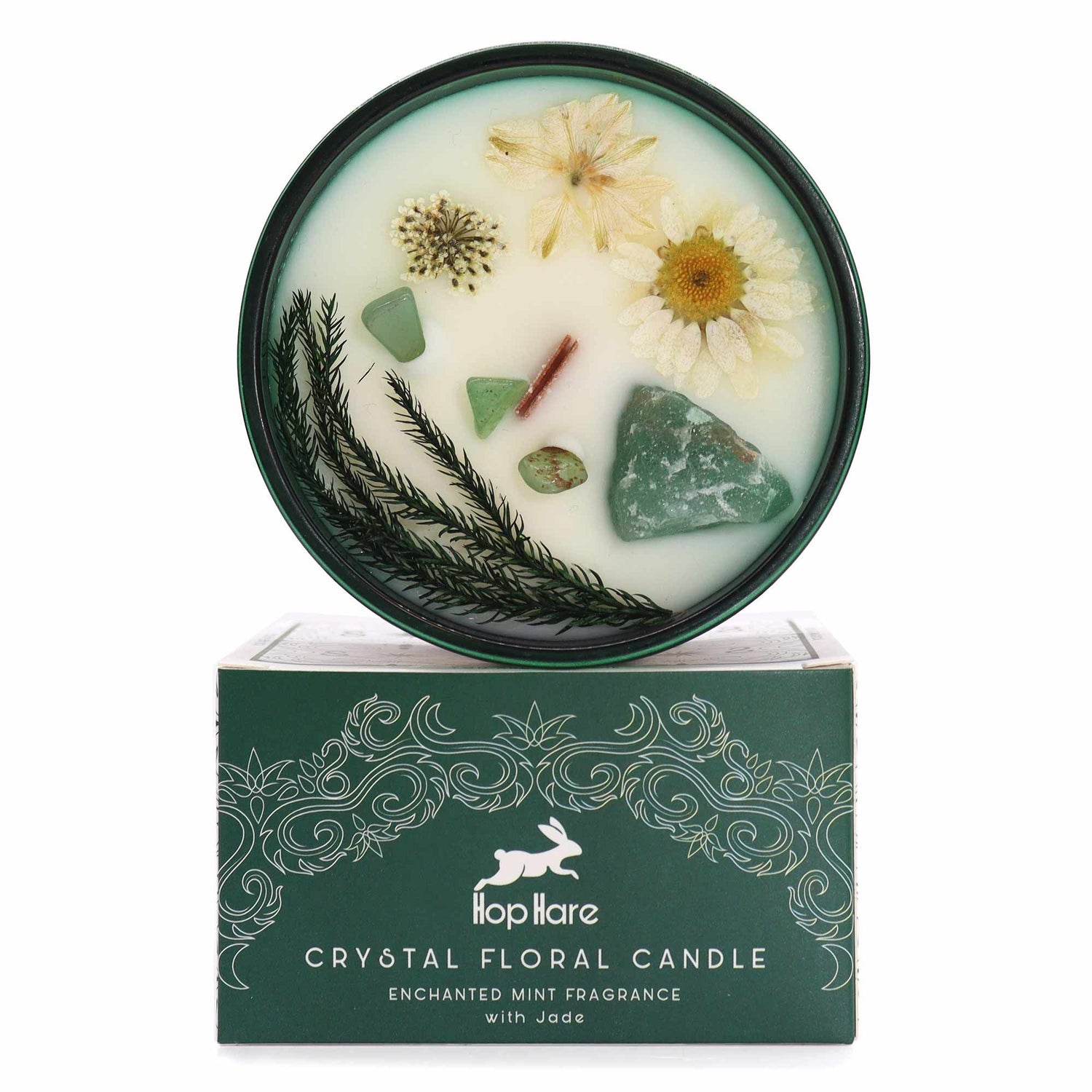 The Magician Tarot-themed crystal candle in a deep green glass jar featuring embedded raw gemstones and dried botanicals.