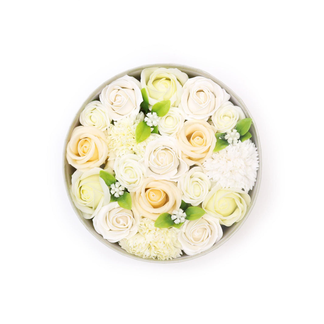 Large round gift box filled with realistic ivory and white soap roses and carnations for wedding celebrations.