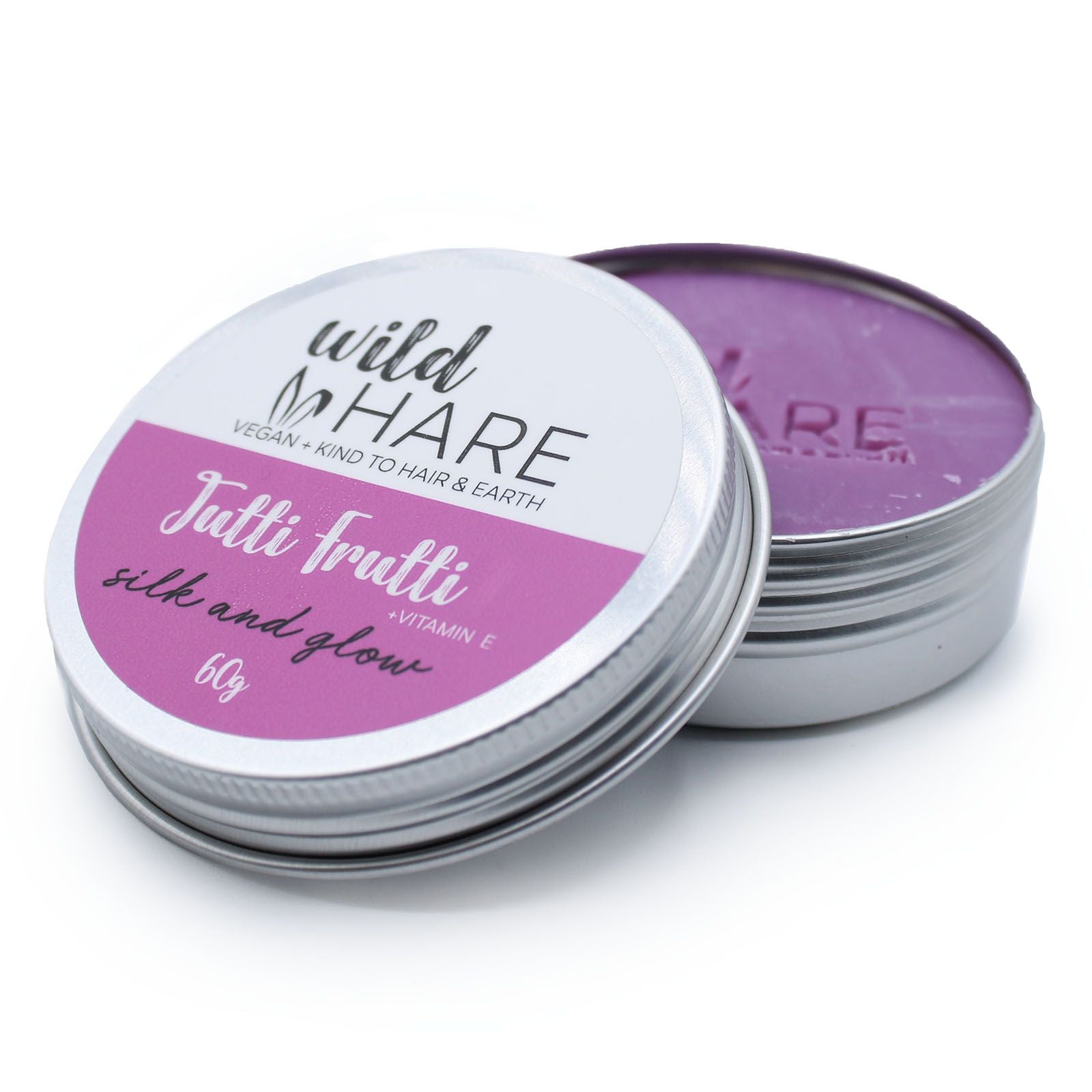A round 60g solid shampoo bar in a purple and pink tin, featuring the Wild Hare "Tutti Frutti" branding.