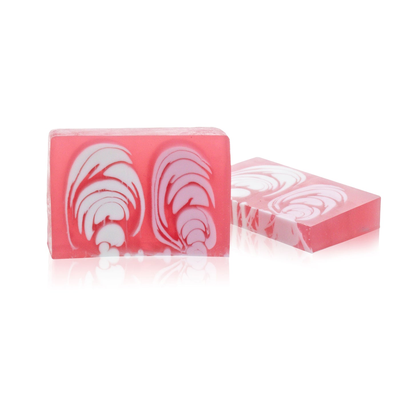 A 100g slice of pink and cream handcrafted rose soap, showing a marbled artisan design.