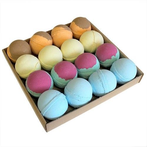 A wooden gift display tray containing sixteen colorful, assorted bath bombs in a variety of bright and marbled patterns.