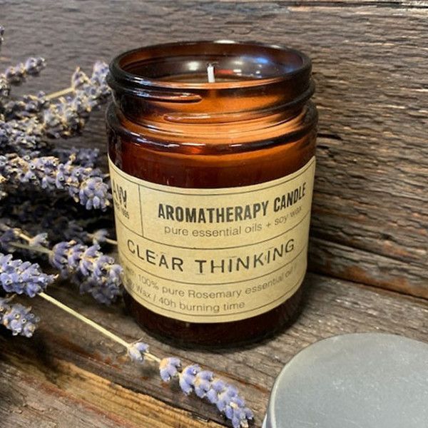 Amber glass aromatherapy candle labeled "Clear Thinking," featuring a blend of pure essential oils in 200g soy wax.