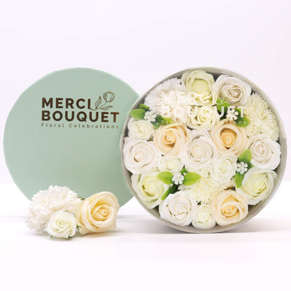 Large round gift box filled with realistic ivory and white soap roses and carnations for wedding celebrations.