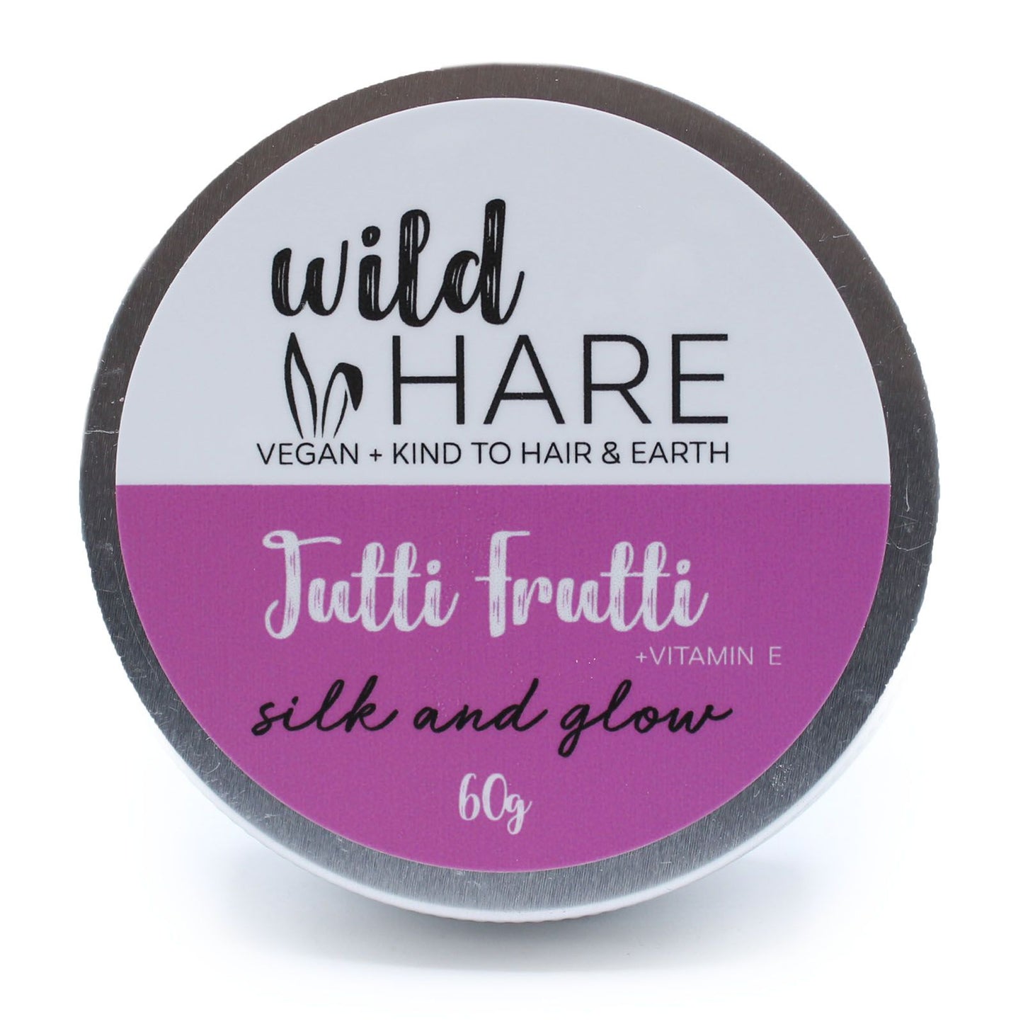 A round 60g solid shampoo bar in a purple and pink tin, featuring the Wild Hare "Tutti Frutti" branding.
