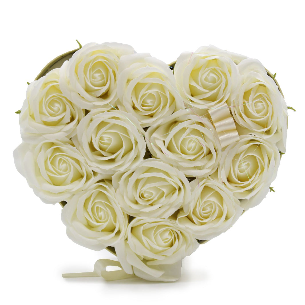 A heart-shaped gift box containing 13 realistic cream-colored soap roses with a luxury finish.