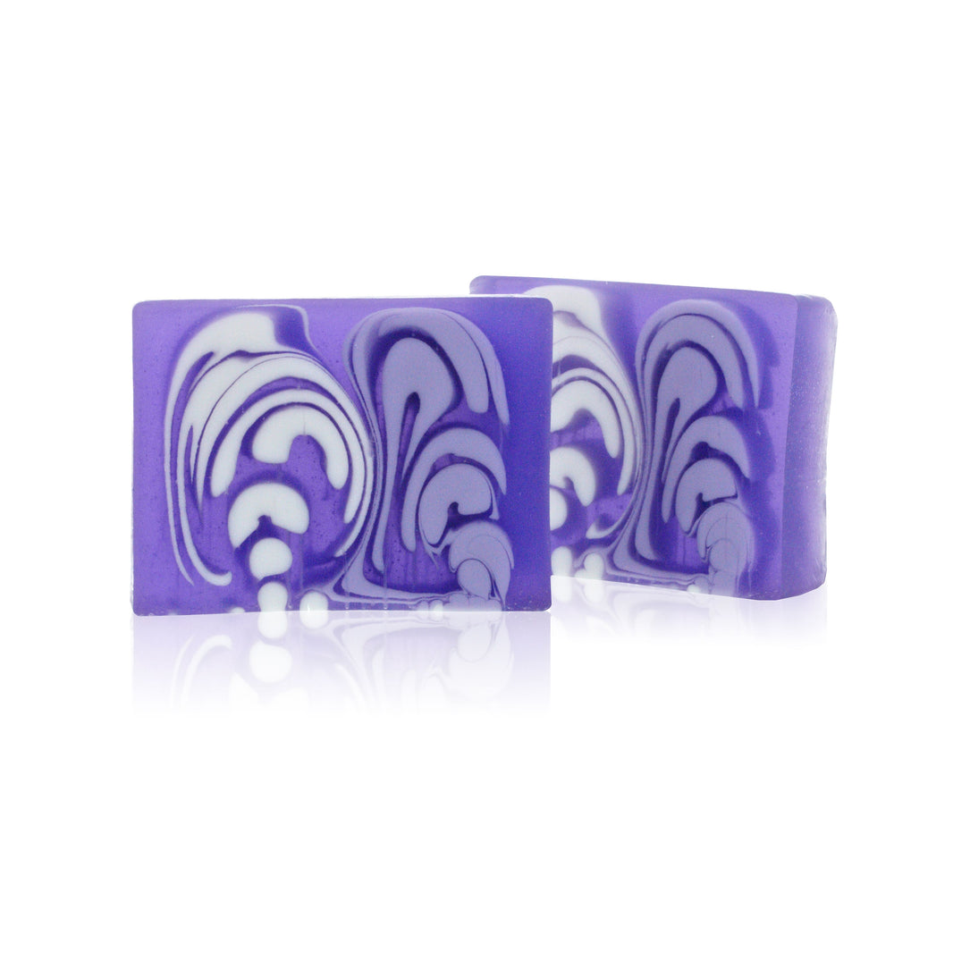 A 100g slice of purple lavender handcrafted soap with a decorative artisan texture.