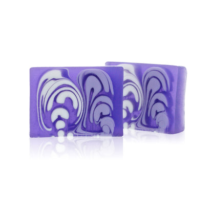 A 100g slice of purple lavender handcrafted soap with a decorative artisan texture.