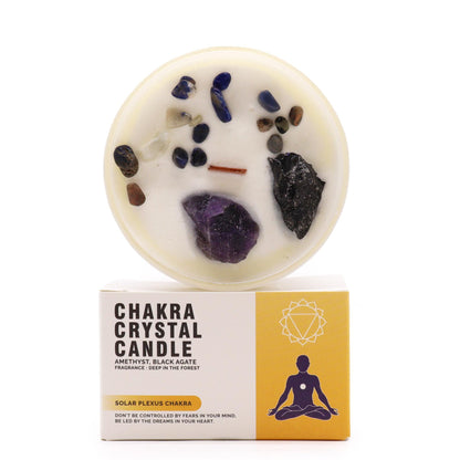 A Solar Plexus Chakra crystal candle topped with yellow raw gemstones and botanicals, designed for personal power and focus.