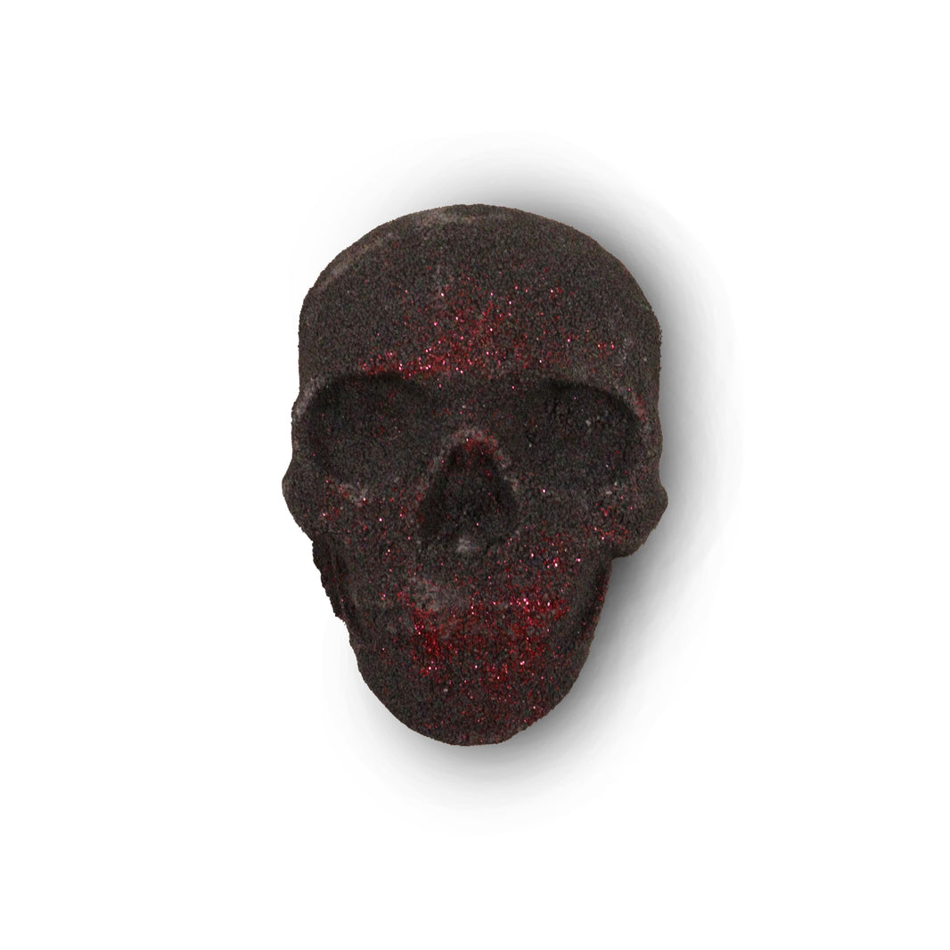 A small 40g dark-toned bath bomb shaped like a human skull, perfect for gothic or alternative gift sets.