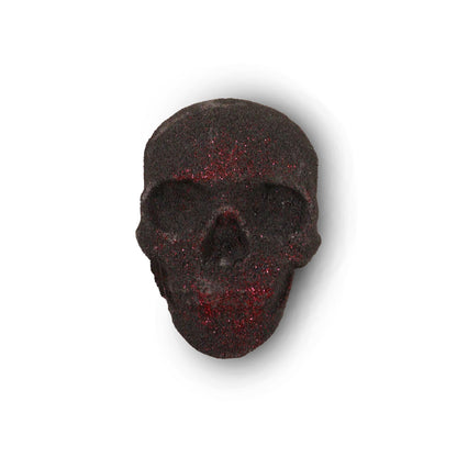 A small 40g dark-toned bath bomb shaped like a human skull, perfect for gothic or alternative gift sets.