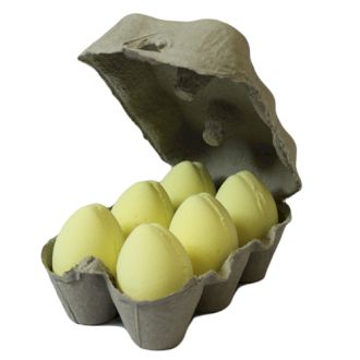 A classic cardboard egg carton filled with six bright yellow egg-shaped bath bombs featuring a sweet banana fragrance.