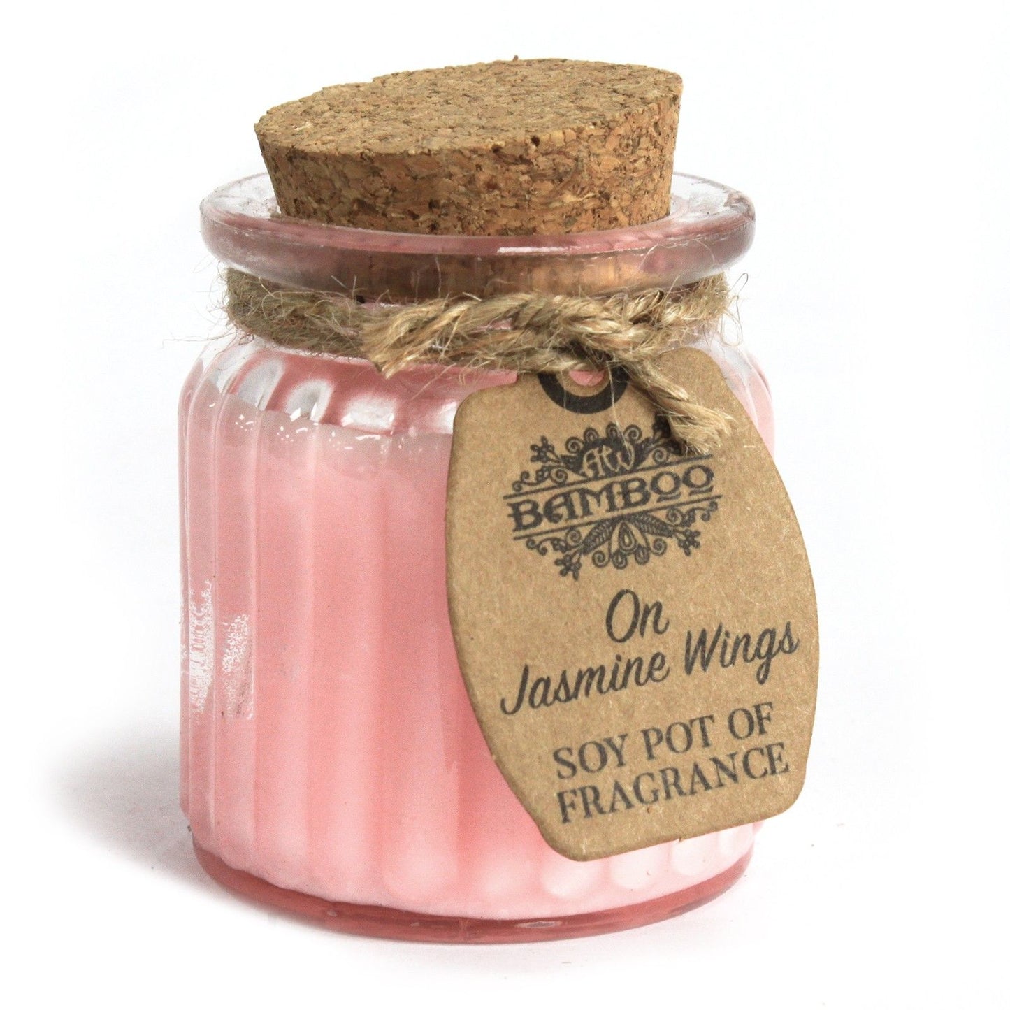 A rustic glass candle pot with light pink wax and a decorative paper label featuring floral butterfly wings.