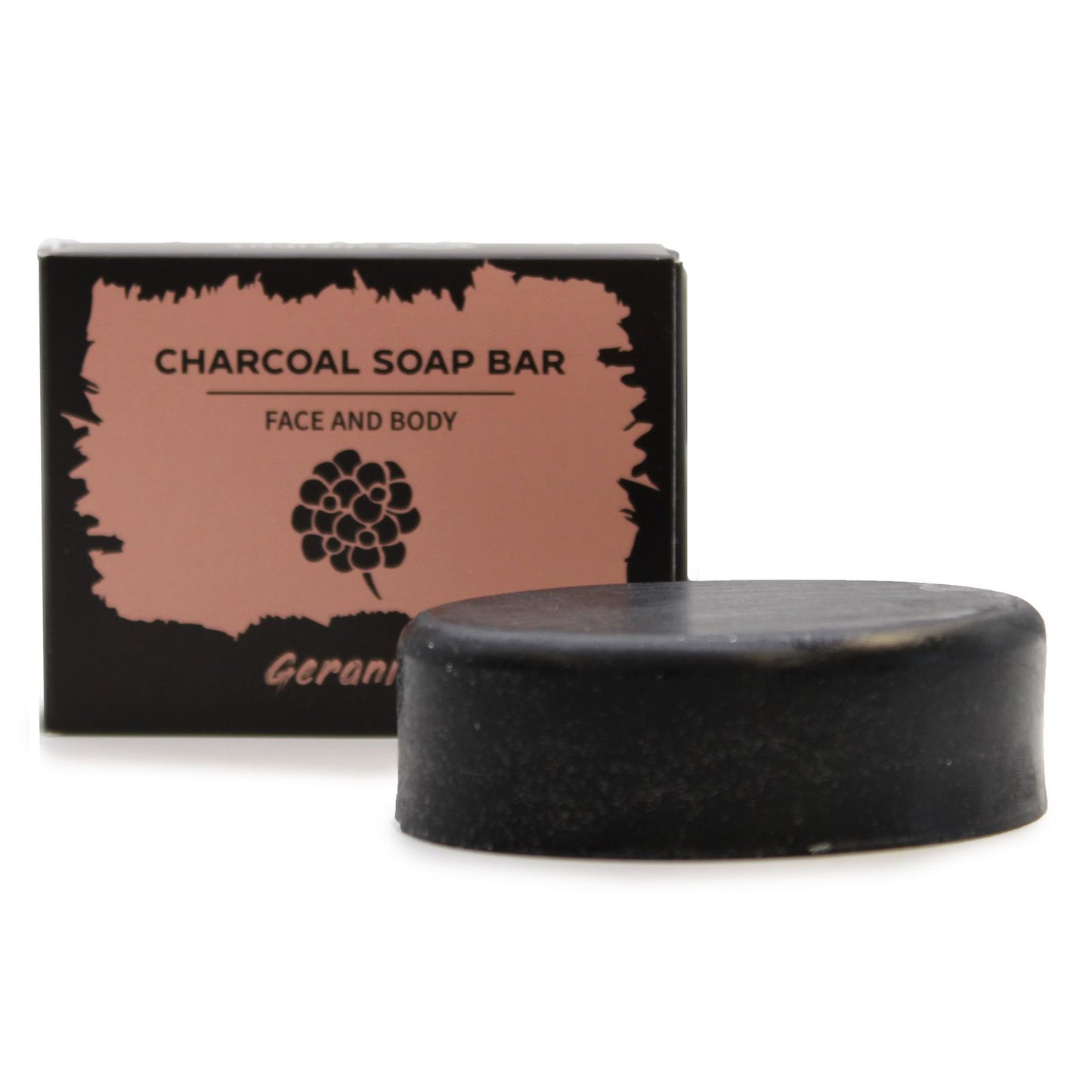 A sleek black charcoal soap bar featuring a minimalist design, packaged in a dark artisan box with floral accents.