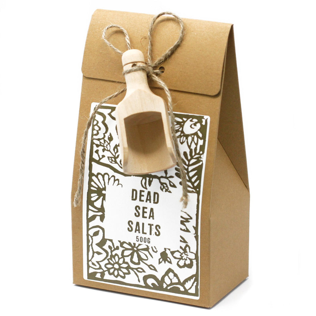 A 500g bag of natural Dead Sea salts, featuring white mineral-rich crystals for skin health and relaxation.