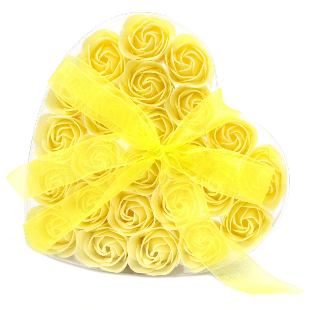A large heart-shaped gift box filled with twenty-four realistic yellow soap rose flowers.