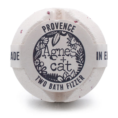 A large white bath fizzer wrapped in plastic with a grey and black label inspired by Provencal lavender.