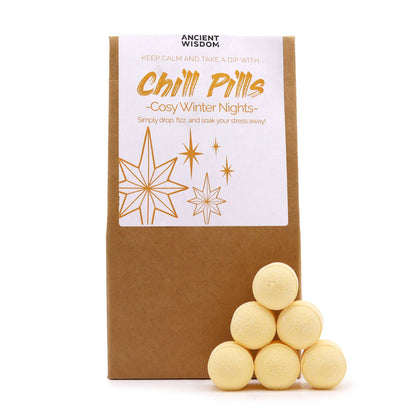 A rustic brown bag filled with light yellow mini bath bombs labeled Cosy Winter Nights with a festive blue design.