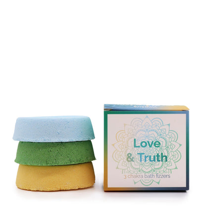 A small gift set containing a green and a light blue square bath fizzer, labeled for the Love and Truth chakras.