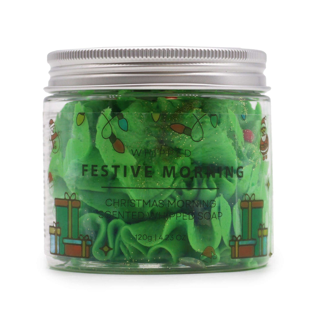 A clear jar filled with vibrant green whipped cream soap featuring a thick, decadent, and pipeable texture.
