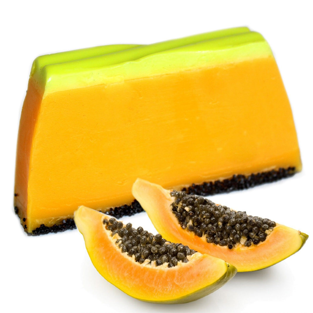 A large 1.1kg bulk artisan soap loaf with vibrant yellow and orange layers, ready to be sliced into individual bars.
