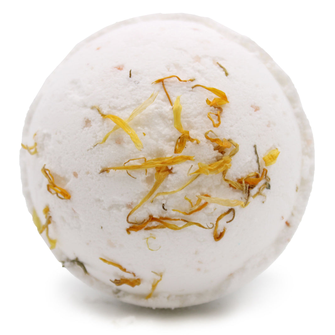 Large 180g white Himalayan salt bath bomb featuring bright yellow and gold botanical accents for an energizing soak.