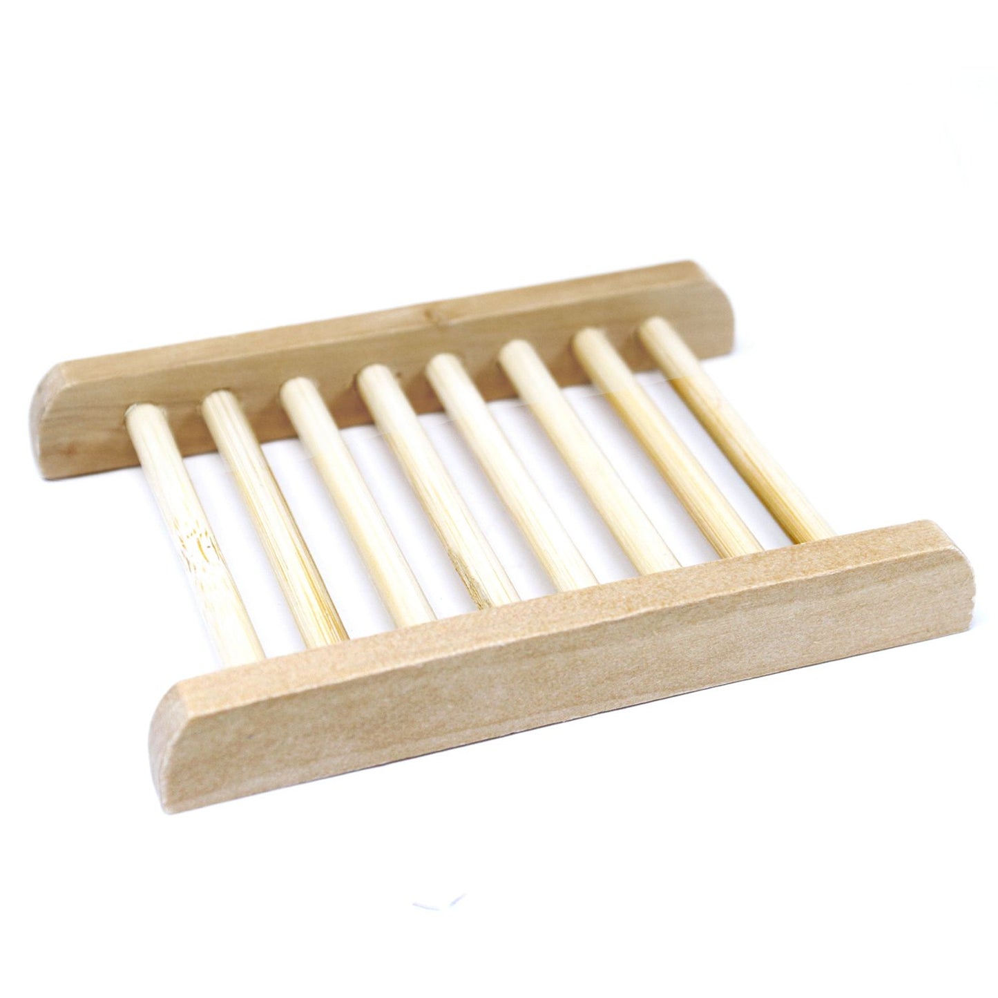 A light-colored natural Hemu wood soap dish in a ladder-style design with thin slats for efficient drainage.