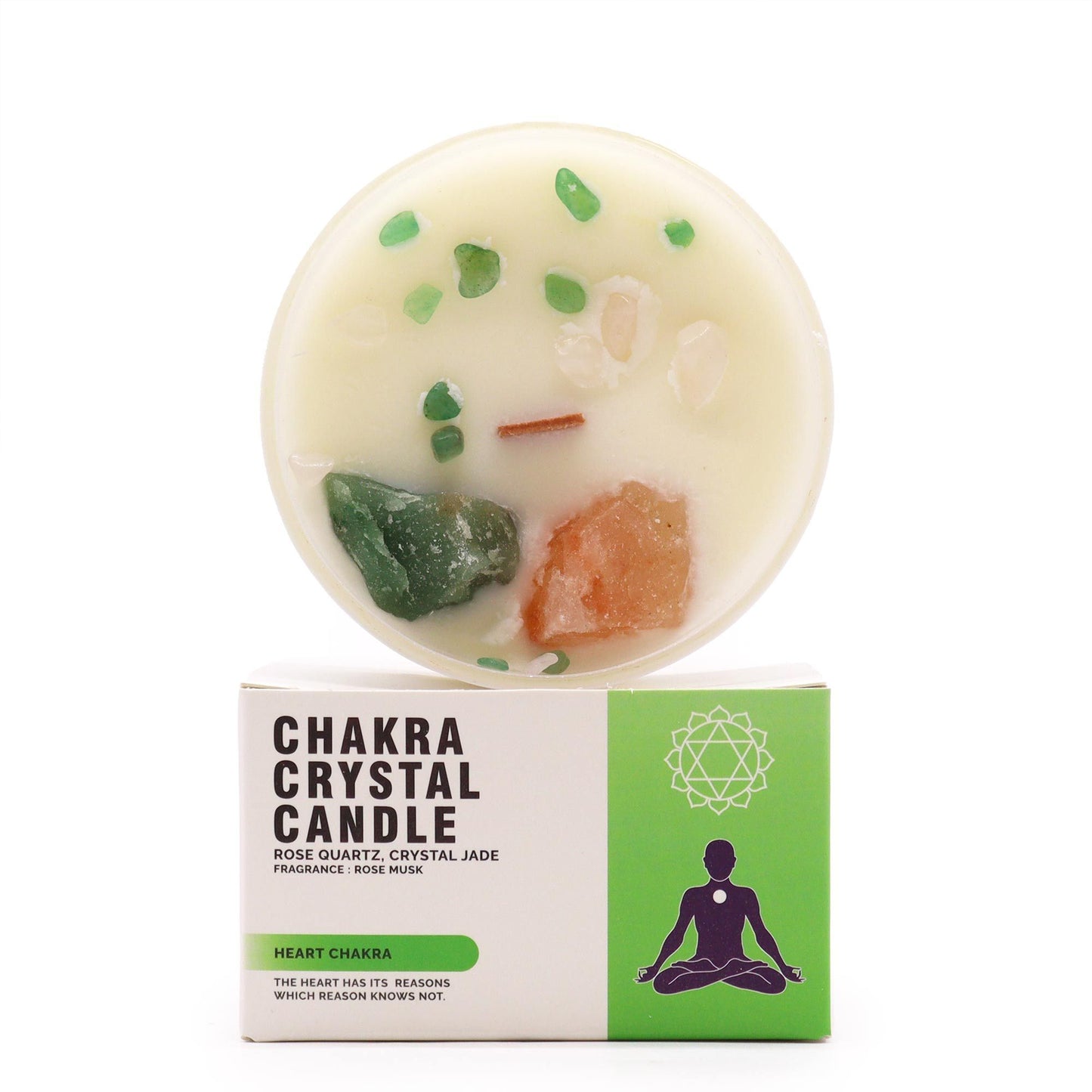 Heart Chakra soy candle with raw rose quartz crystals and green botanical toppings in a glass jar with its branded box.