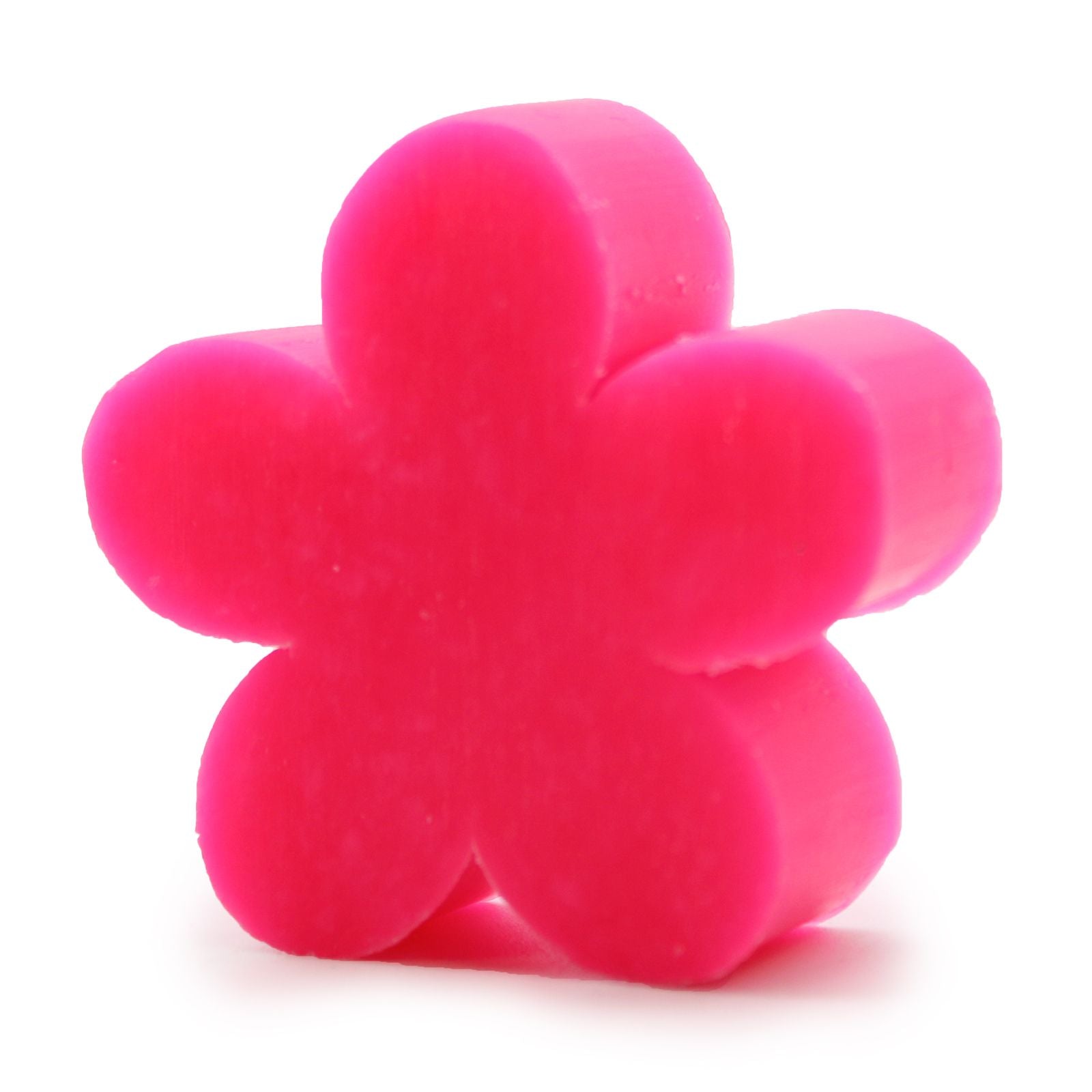 A small, bright pink artisan guest soap bar sculpted into a realistic flower shape with defined, layered petals.