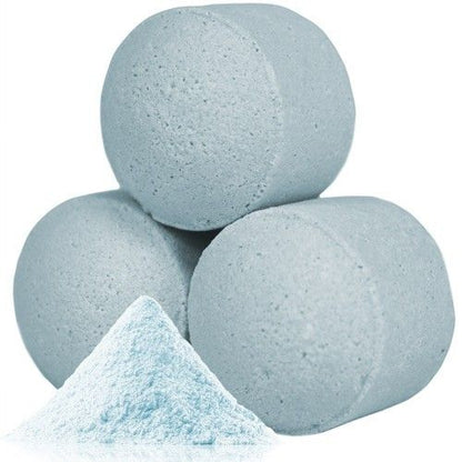 A bulk box filled with dozens of soft blue mini bath bombs featuring a classic, soothing baby powder fragrance.