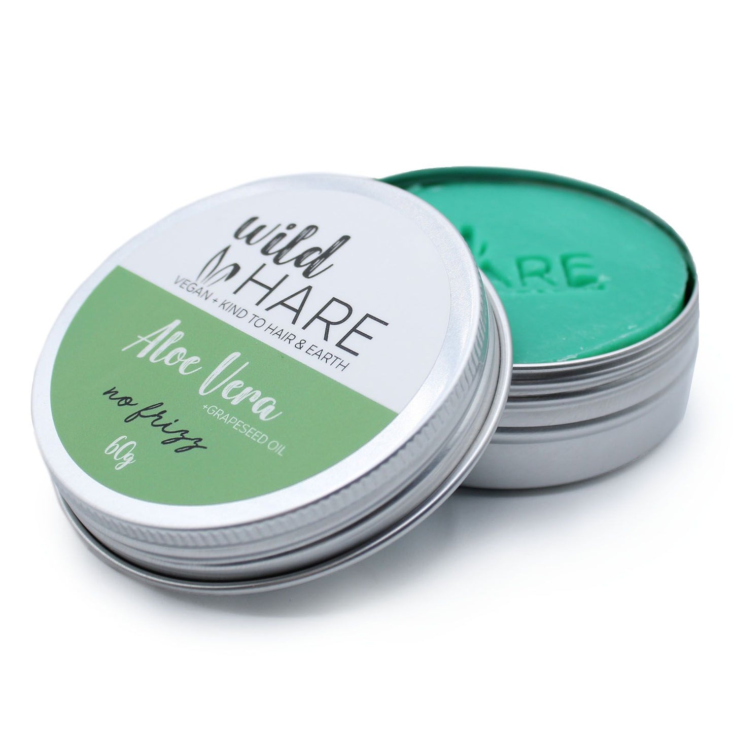 A 60g green-labeled Wild Hare solid shampoo bar with aloe vera, packaged in a reusable metal storage tin.