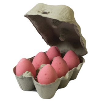 A realistic grey cardboard egg carton containing six deep pink, cherry-scented egg-shaped bath bombs.

714. Aromatherapy Sho