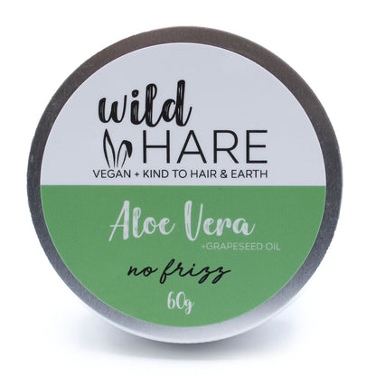 A 60g green-labeled Wild Hare solid shampoo bar with aloe vera, packaged in a reusable metal storage tin.