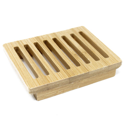 A natural light-colored Hemu wood soap dish in a box-style design with drainage slats for artisan bar soap.