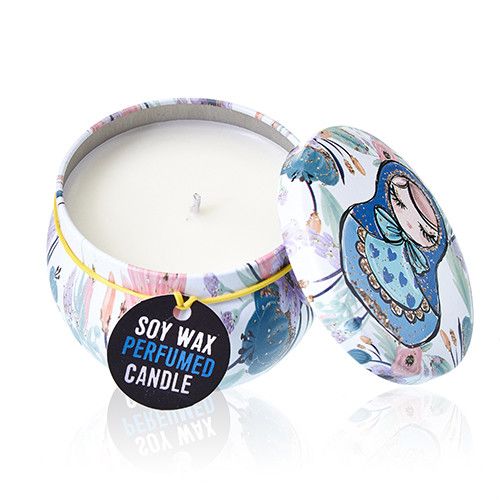 A round decorative metal candle tin with a vibrant illustration of traditional Matryoshka dolls on the lid.