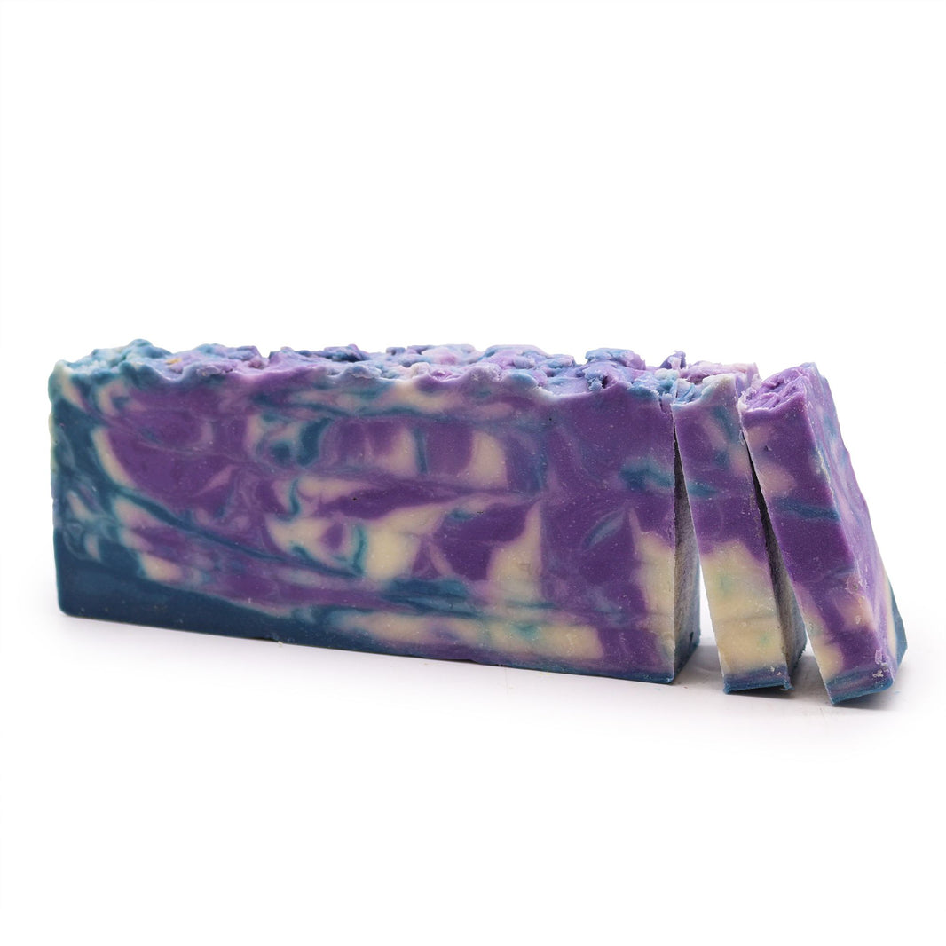 A 110g artisan olive oil soap slice featuring purple and white marbled layers and a fresh botanical fragrance.